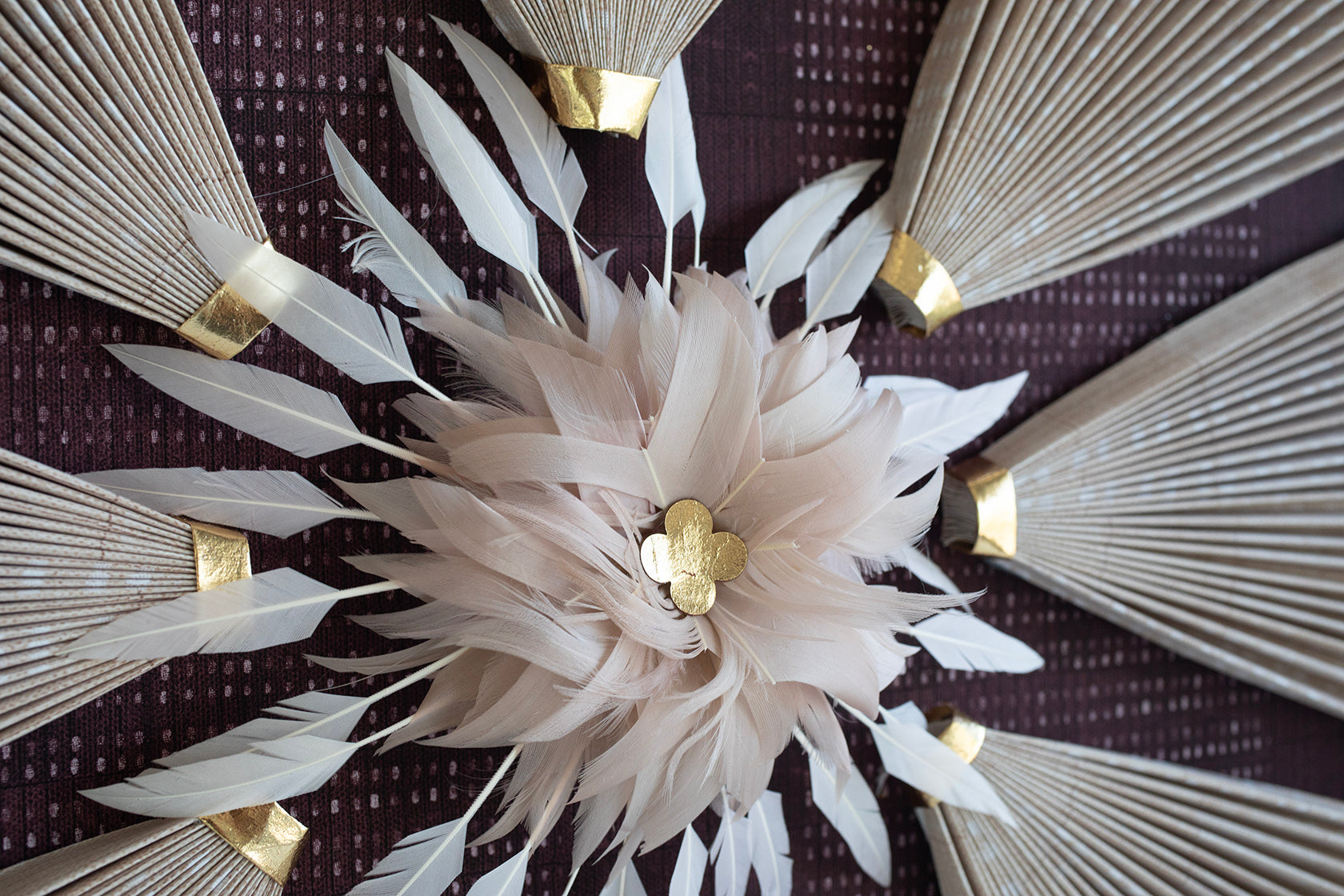 Blush pleated fans with feather detail